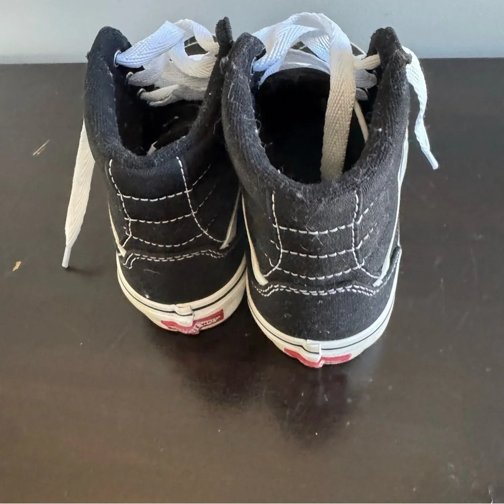 Vans Kid’s “Missy” Black and White High-Top Sneakers